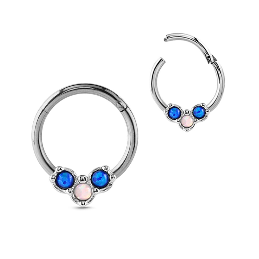 surgical steel hinged clicker hoop with a triple faux opal design featuring a center white stone and 2 blue stones on either side. Images shows the ring closed and open