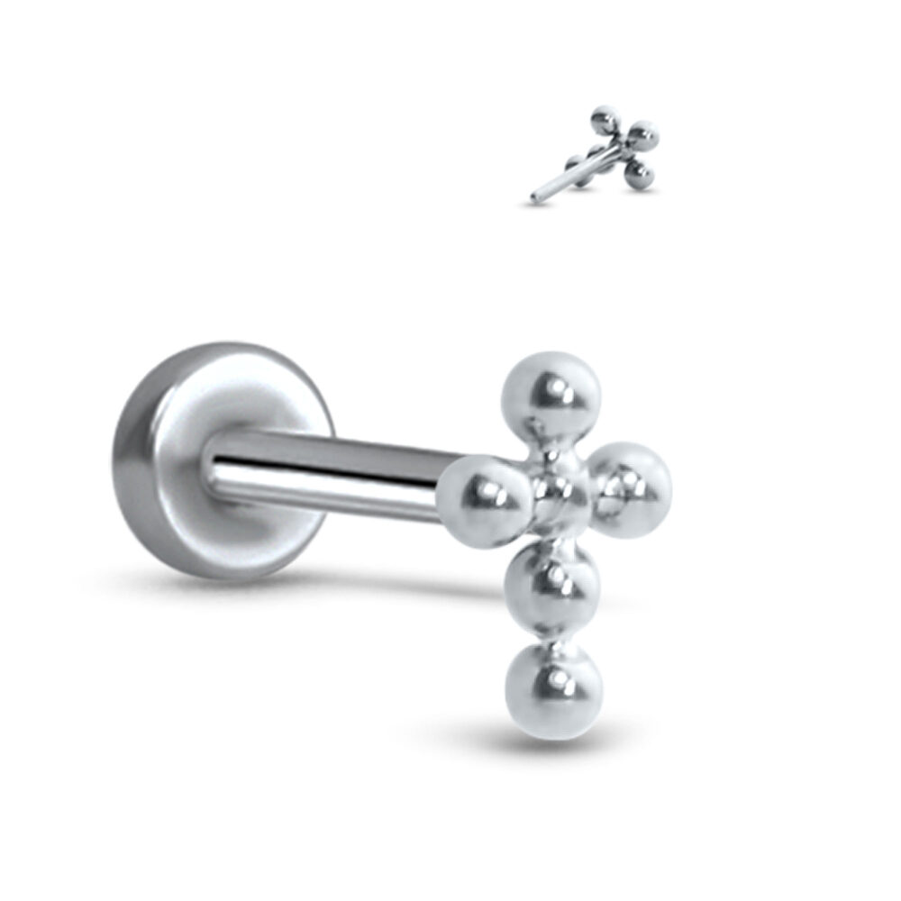 titanium push pin style labret stud featuring a studded cross design. Image also shows the back side of the cross insert
