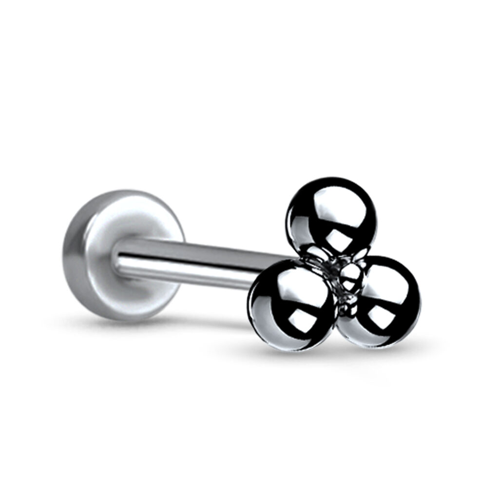 Steel colored titanium push pin style labret stud featuring a triple ball design