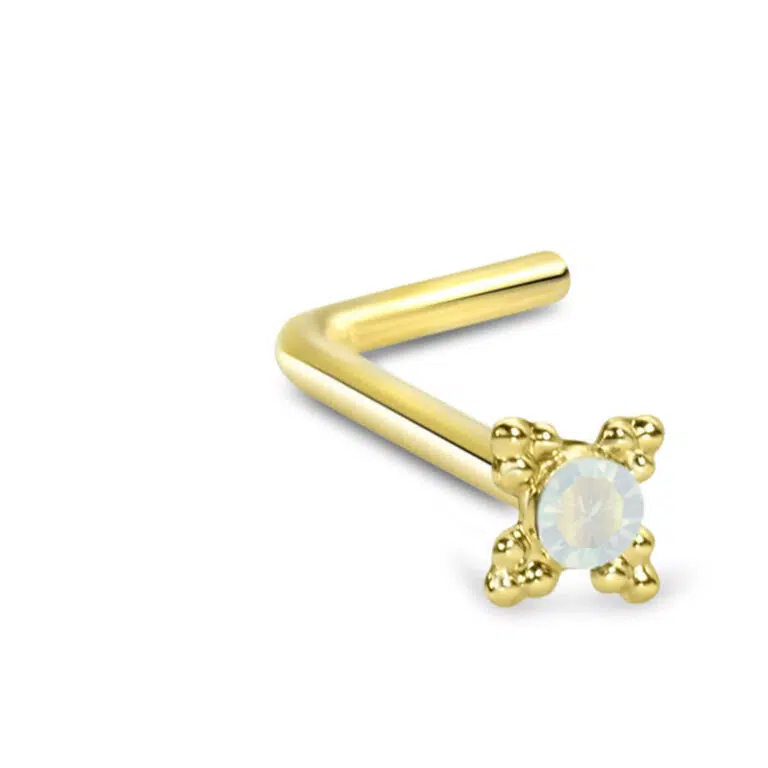 yellow gold lbend nose stud featuring a tribal design with a faux white opal center stone